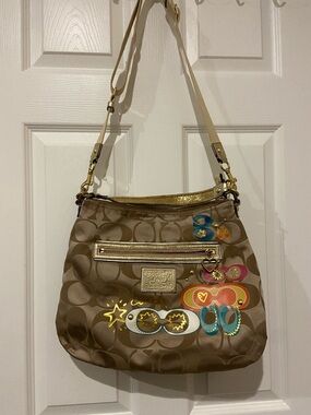 Coach Brown Signature Canvas Shoulder Bag with Gold Trim and Colorful Appliqués